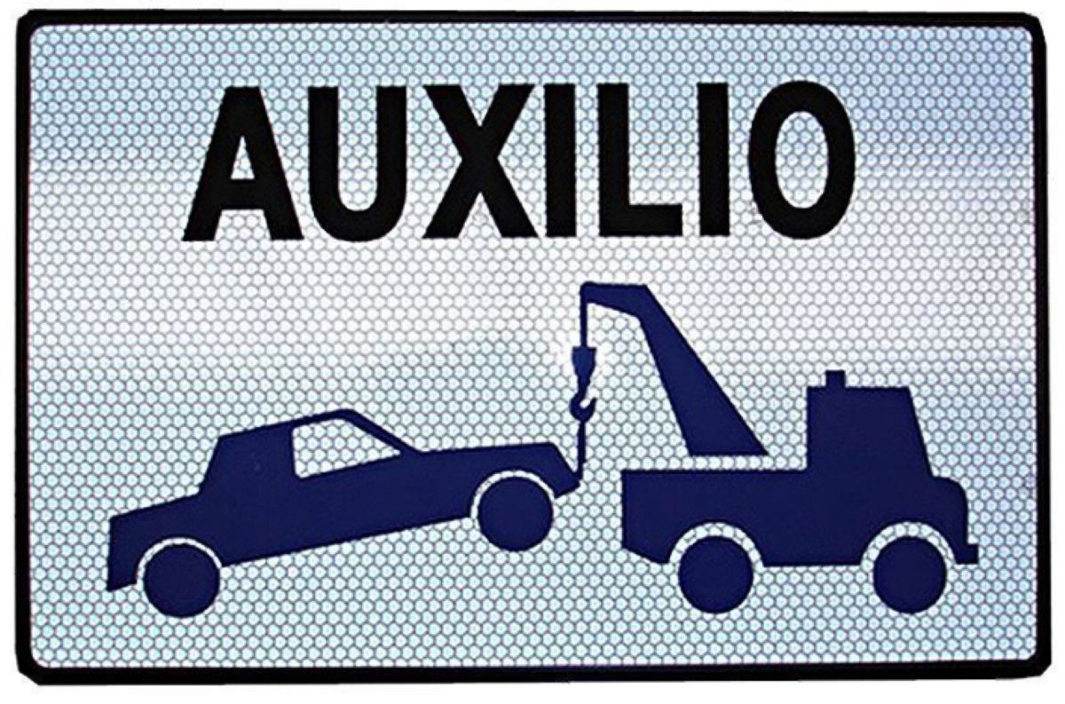 Placa Grúa de servicio auxilio en carretera. Foto de archivo