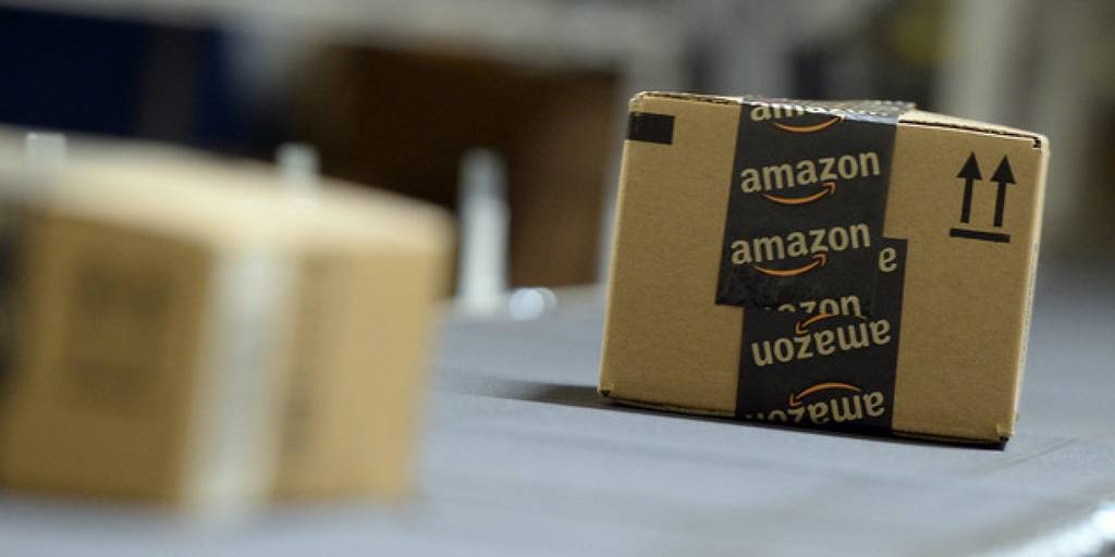 SAN BERNARDINO, OCTOBER 29: Shipping orders go by on a conveyor belt at Amazon's San Bernardino Fulfillment Center October 29, 2013 in San Bernardino, California. Amazon's 1 million square-foot facility in the hard hit San Bernardino County has created more than 800 jobs at the center. Fulfillment centers are where products sold by other vendors on Amazon.com store their inventory. (Photo by Kevork Djansezian/Getty Images)
