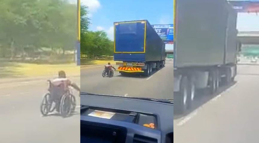 Imagen de un hombre en silla de ruedas agarrado a un camión